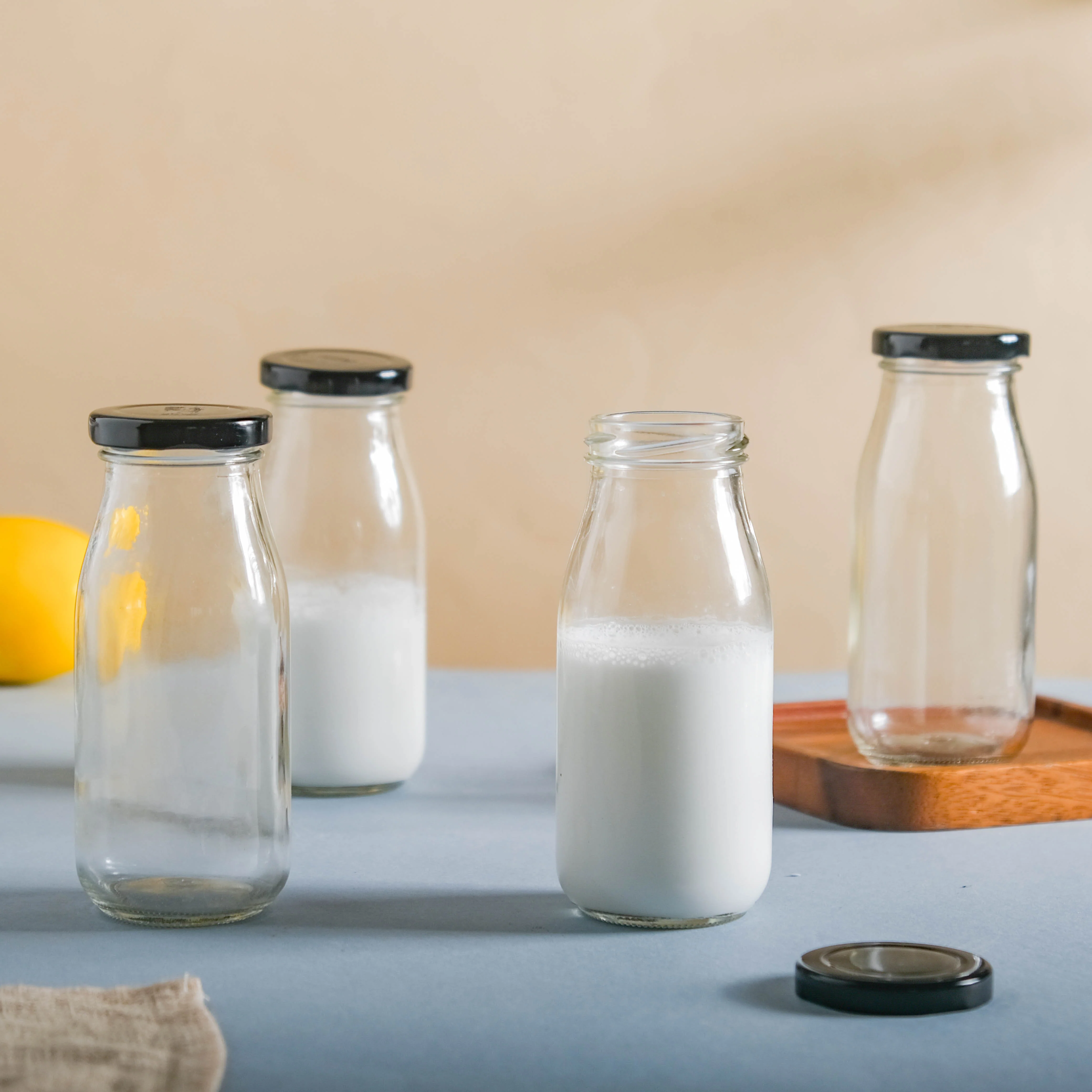 Small Glass Bottle with Lid Set of 4 - Image 6
