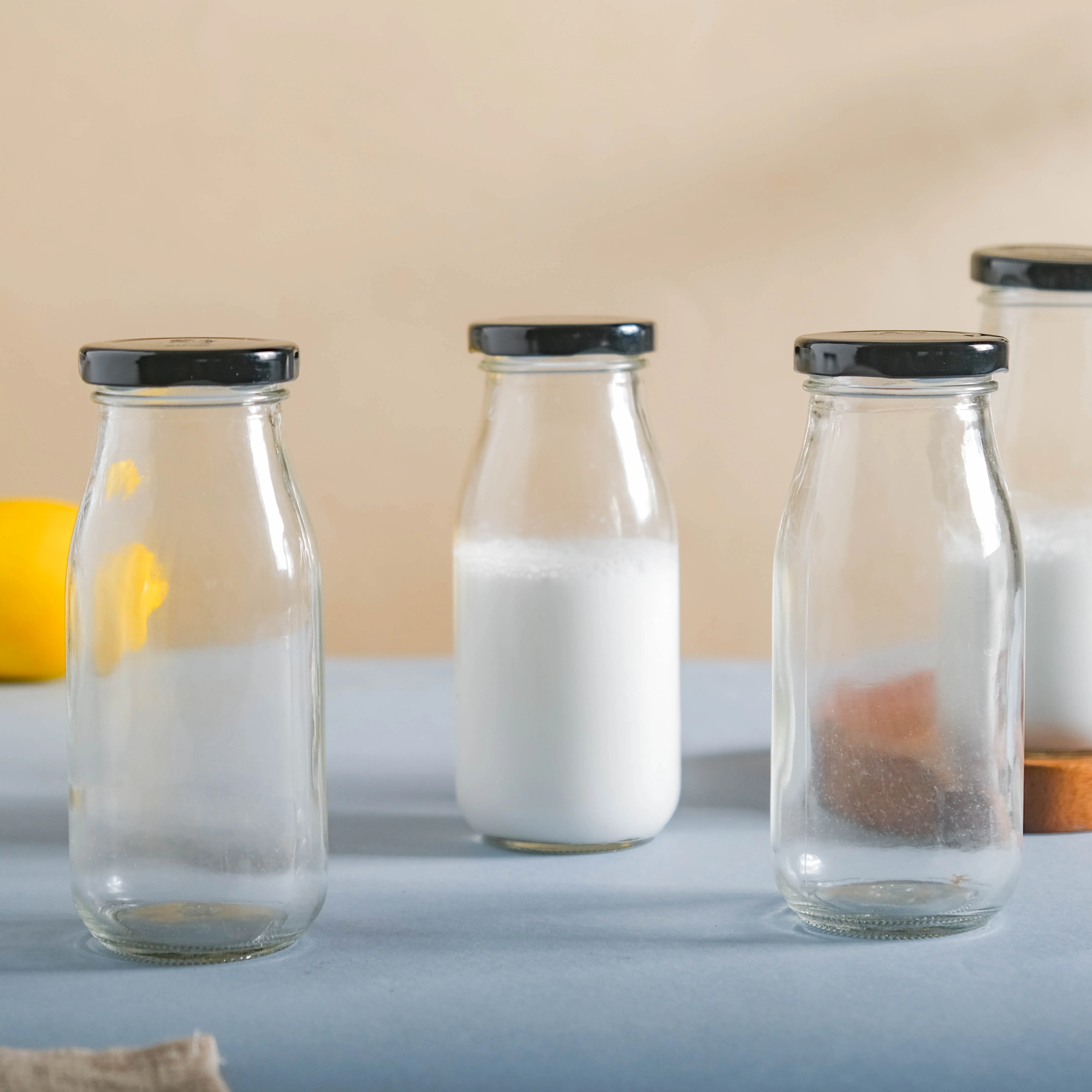Small Glass Bottle with Lid Set of 4 - Image 7